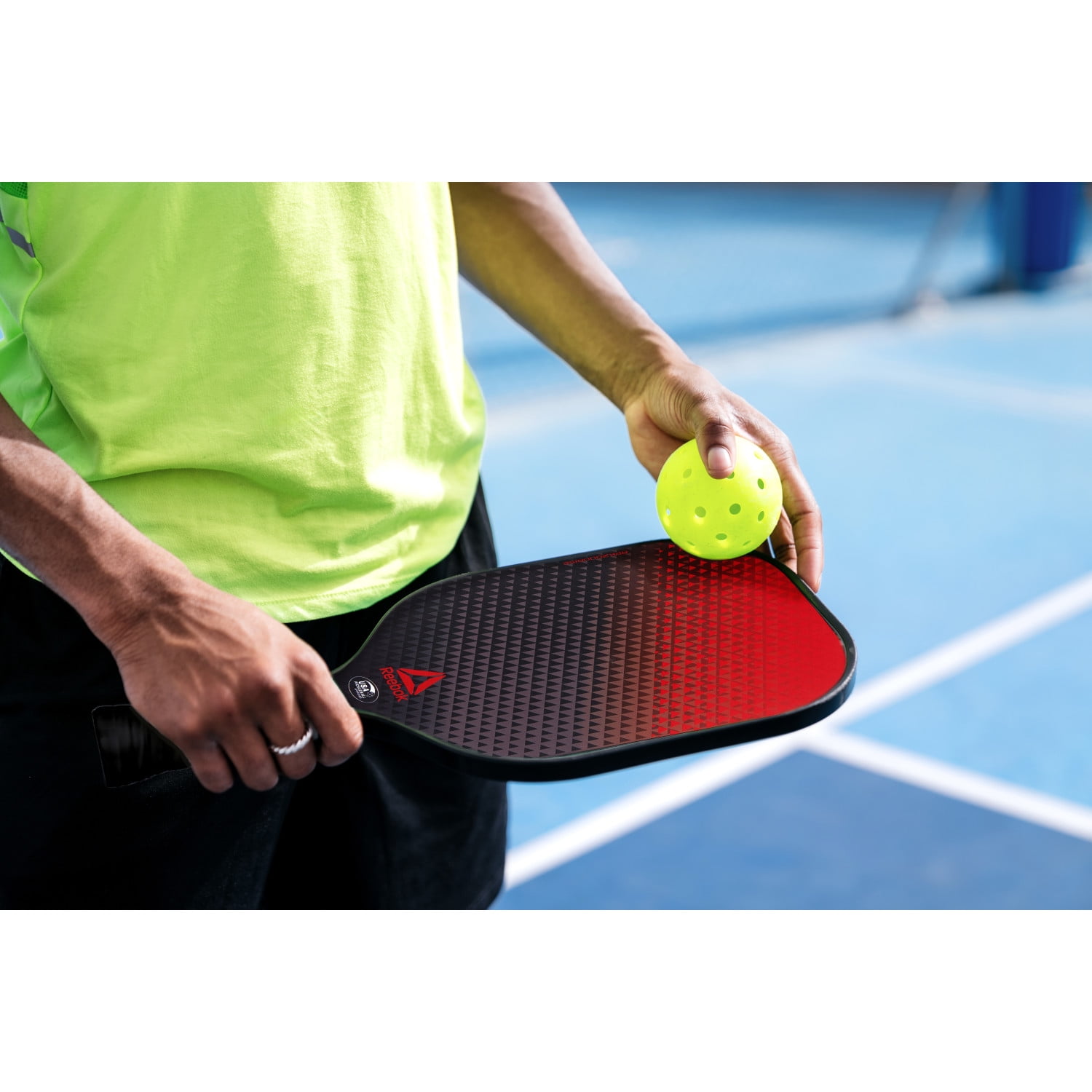 Reebok 7-Piece Pickleball Paddle Set with Fiberglass Surface and Cushioned Grip (2 Paddles, 4 Balls, 1 Bag) g3x2a