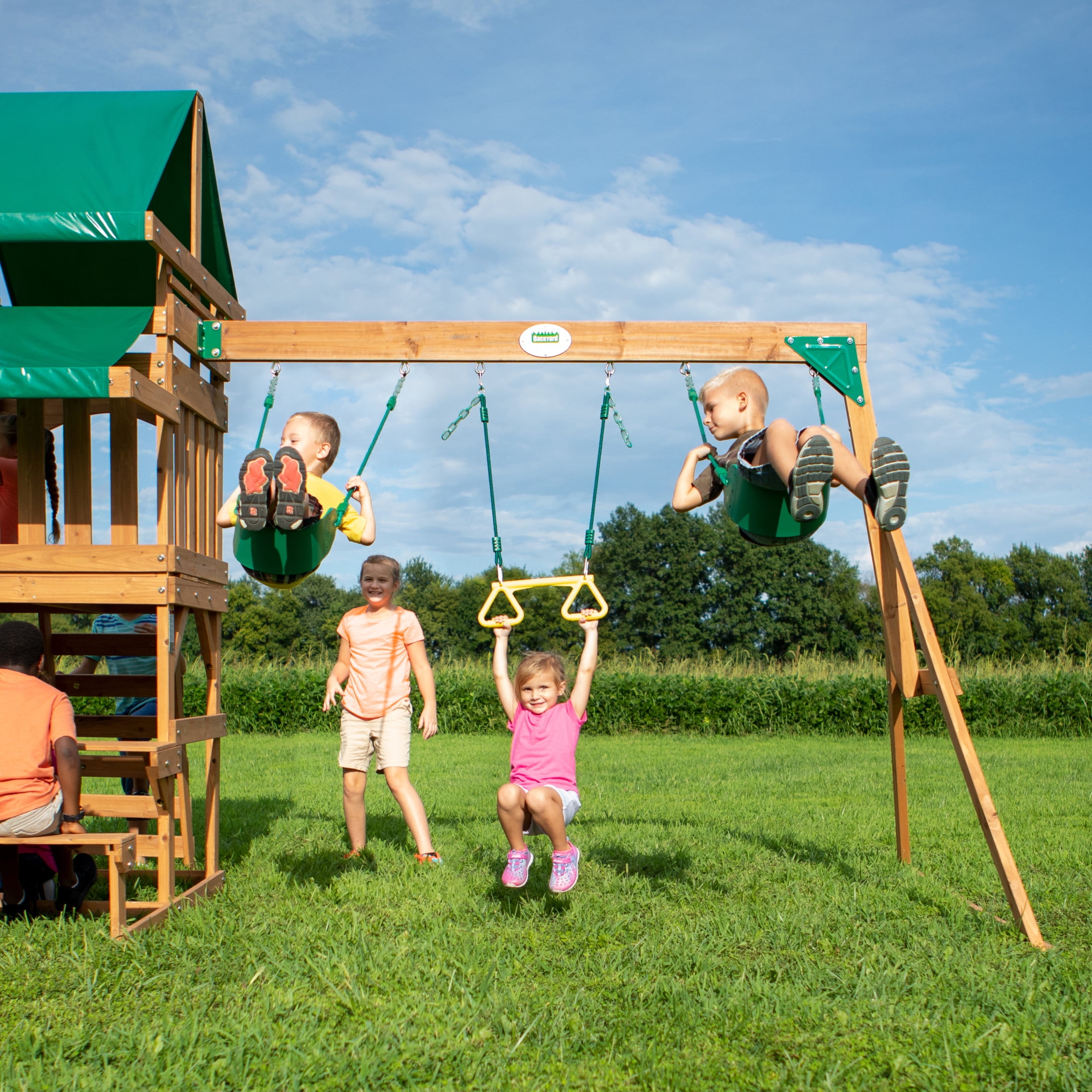 Backyard Discovery Belmont Cedar Wood Swing Set with Slide, Play Deck, and Rock Wall Ladder (White Canopy, 1 Unit) dtlr1