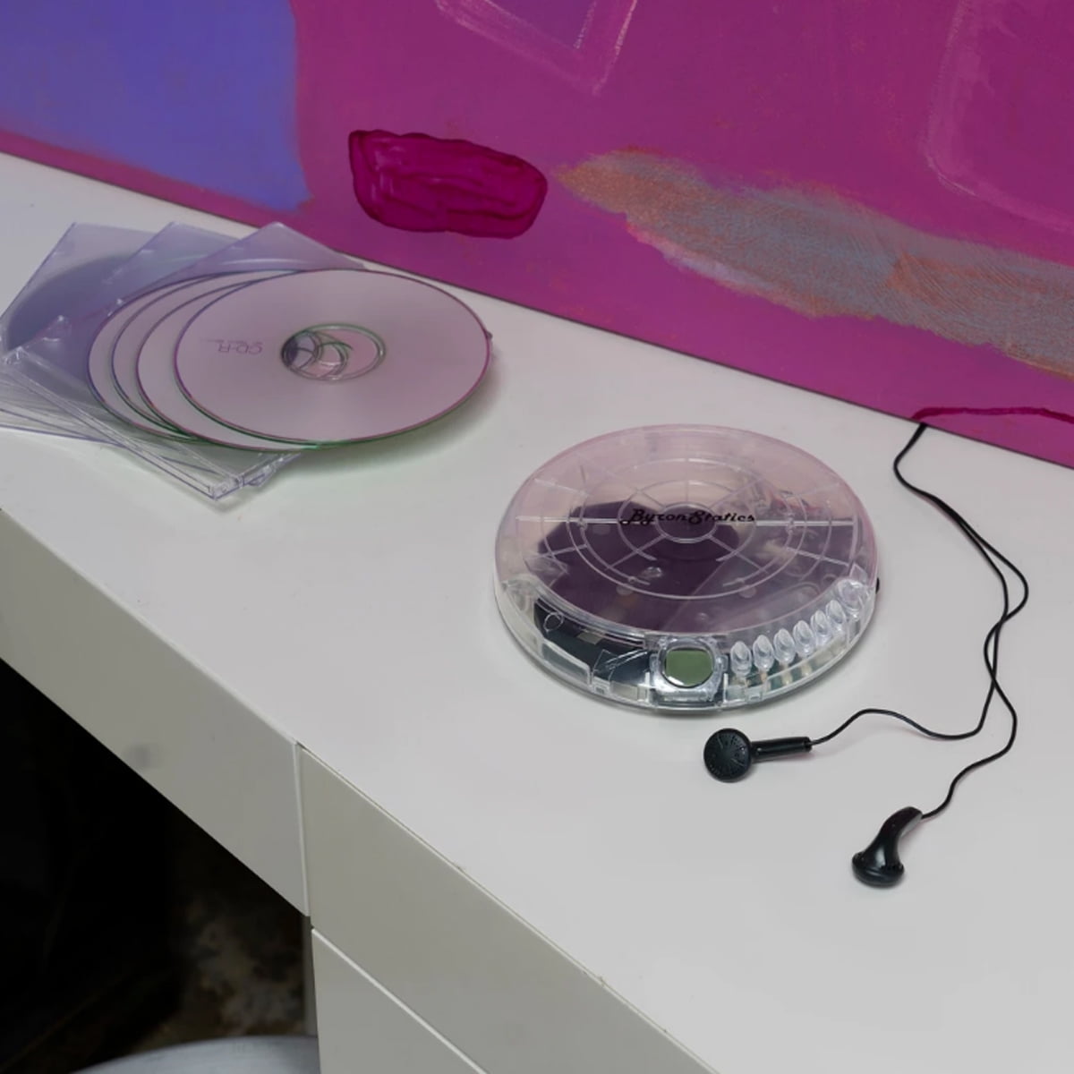Byron Statics Portable CD Player, Personal Compact Disc Walkman with EQ Modes and Earbuds (Clear, 5.83 x 5.31 x 0.87 in) e5ys1